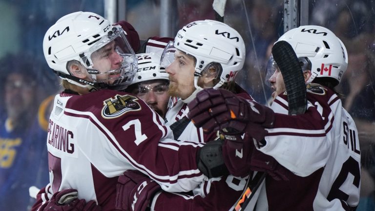 Peterborough Petes' Shawn Spearing, from left to right, Tucker Robertson, Brennan Othmann and Chase Stillman celebrate Robertson's goal against the Quebec Remparts during second period Memorial Cup hockey action, in Kamloops, B.C., on Tuesday, May 30, 2023. (Darryl Dyck/THE CANADIAN PRESS)
