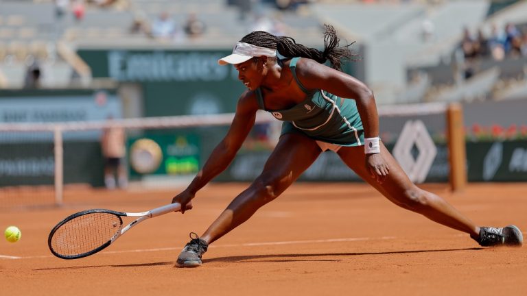Sloane Stephens of the U.S. slides t play a shot against Karolina Pliskova of the Czech Republic during their first round match of the French Open tennis tournament at the Roland Garros stadium in Paris, Monday, May 29, 2023. (Jean-Francois Badias/AP)