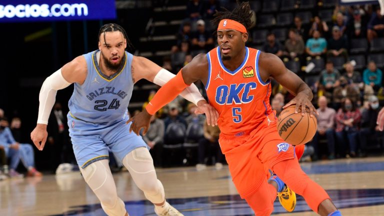 Oklahoma City Thunder forward Luguentz Dort (5) handles the ball against Memphis Grizzlies forward Dillon Brooks (24) in the first half of an NBA basketball game. (Brandon Dill/AP)