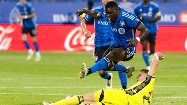 CF Montreal forward Sunusi Ibrahim (14) is stopped by Nashville SC defender Josh Bauer (22) during second half MLS soccer action on Wednesday, June 21, 2023 in Montreal. (CP)