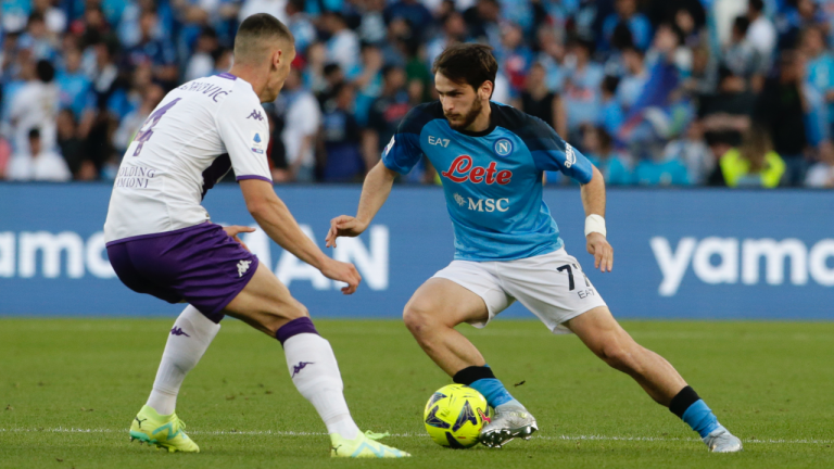 Napoli's Khvicha Kvaratskhelia, right, and Fiorentina's Nikola Milenkovic, vie for the ball during the Italian Serie A soccer match between Napoli and Fiorentina at the Diego Armando Maradona stadium in Naples, Italy, Sunday, May 7, 2023. (Alessandro Garofalo/LaPresse via AP)
