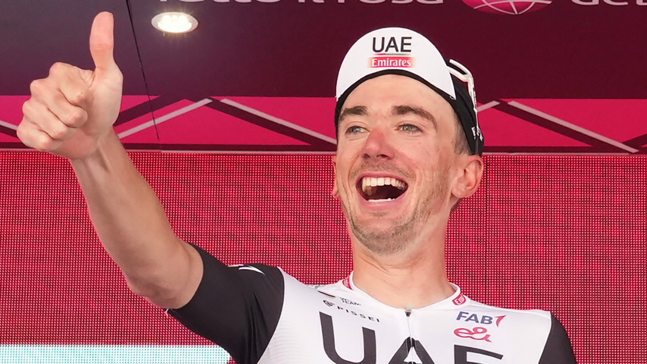Brandon McNulty celebrates on podium after winning the 15th stage of the Giro D'Italia, tour of Italy cycling race from Seregno to Bergamo, Italy, Sunday, May 21, 2023. (Gian Mattia D'Alberto/AP)