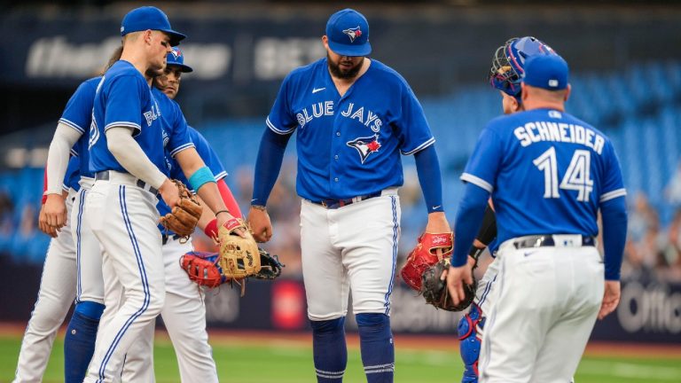 Toronto Blue Jays starting pitcher Alek Manoah (6) steps off the mound before being pulled by manager John Schneider (14) against the Houston Astros in first inning American League MLB baseball action in Toronto on Monday, June 5, 2023. Andrew Lahodynskyj/THE CANADIAN PRESS