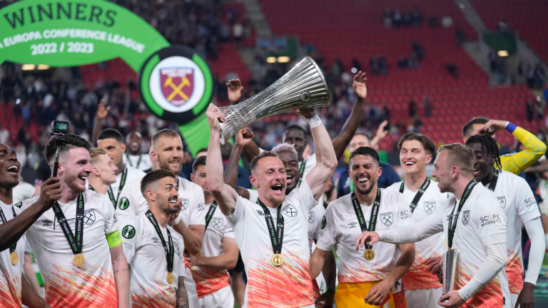 West Ham players celebrates with the trophy after winning the Europa Conference League final soccer match against Fiorentina and West Ham at the Eden Arena in Prague, Wednesday, June 7, 2023. (AP Photo/Darko Bandic)