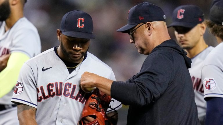 Cleveland Guardians manager Terry Francona, right, takes the baseball from relief pitcher Xzavion Curry during the sixth inning of the team's baseball game against the Arizona Diamondbacks on Friday, June 16, 2023, in Phoenix. (Ross D. Franklin/AP)