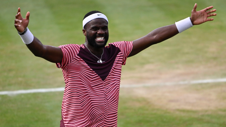 United States' Frances Tiafoe celebrates after winning the final match of the Stuttgart Open against Germany's Jan-Lennard Struff, in Stuttgart, Germany, Sunday, June 18, 2023. Tiafoe won 4-6, 7-6 (1), 7-6 (8). (Marijan Murat/dpa via AP)