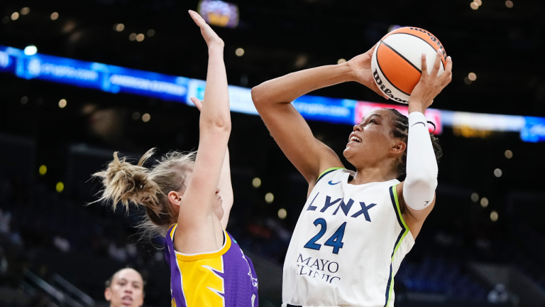 Minnesota Lynx forward Napheesa Collier, right, shoots as Los Angeles Sparks Karlie Samuelson defends during the first half of a WNBA basketball game Tuesday, June 20, 2023, in Los Angeles. (AP Photo/Mark J. Terrill)
