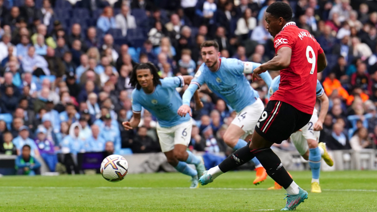 Manchester United's Anthony Martial scores their side's third goal of the game from a penalty during the Premier League match at the Etihad Stadium, Manchester, on Sunday October 2, 2022. (AP)