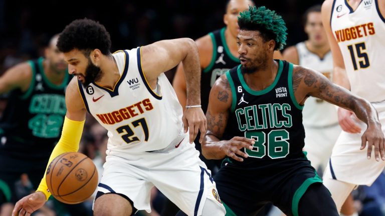 Denver Nuggets' Jamal Murray (27) loses control of the ball against Boston Celtics' Marcus Smart (36) during the first half of an NBA basketball game. (Michael Dwyer/AP)