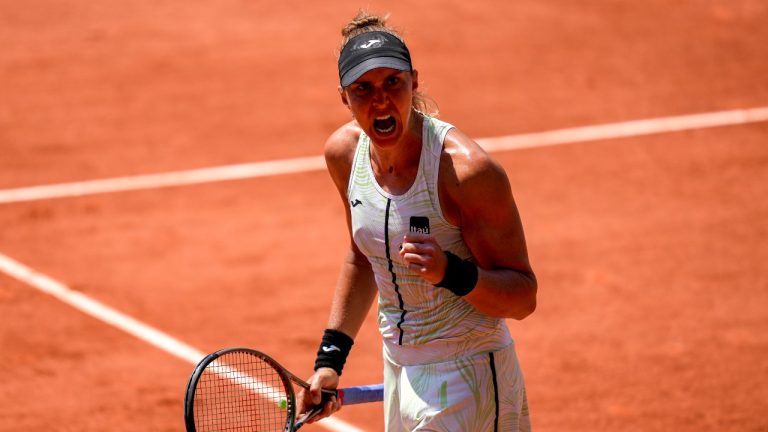 Brazil's Beatriz Haddad Maia celebrates reaching match point against Tunisia's Ons Jabeur during their quarterfinal match of the French Open tennis tournament. (Thibault Camus/AP)