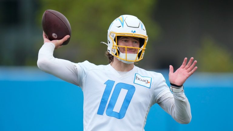Los Angeles Chargers quarterback Justin Herbert (10) runs a drill during the NFL football team's camp in Costa Mesa, Calif., Wednesday, June 14, 2023. (Jae C. Hong/AP)