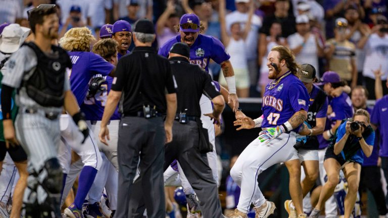 LSU's Tommy White (47) is greeted at the plate after his game-winning home run against Wake Forest during the 11th inning of a baseball game at the NCAA College World Series in Omaha, Neb., Thursday, June 22, 2023. (John Peterson/AP)