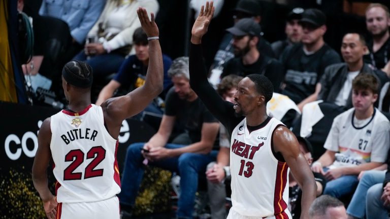 Miami Heat center Bam Adebayo, right, celebrates with forward Jimmy Butler after scoring against the Denver Nuggets during the second half of Game 2 of basketball's NBA Finals, Sunday, June 4, 2023, in Denver. (David Zalubowski/AP)