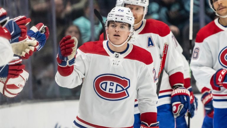 Montreal Canadiens forward Cole Caufield is congratulated by teammates on the bench after his goal against the Seattle Kraken during the second period of an NHL hockey game Tuesday, Dec. 6, 2022, in Seattle. (Stephen Brashear/AP)