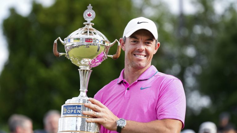 Rory McIlroy of Northern Ireland reacts with the trophy after winning the Canadian Open at St. George's Golf and Country Club in Toronto on Sunday, June 12, 2022. (Nathan Denette/CP)