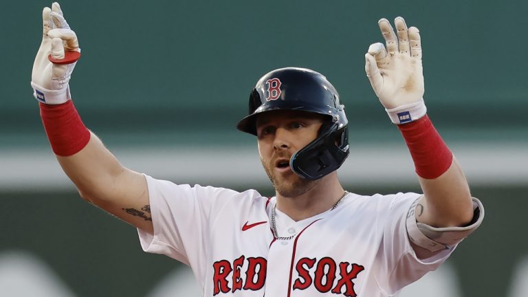 Boston Red Sox's Trevor Story reacts after hitting an RBI-double during the seventh inning of a baseball game against the Texas Rangers, Saturday, Sept. 3, 2022, in Boston. (Michael Dwyer/AP)