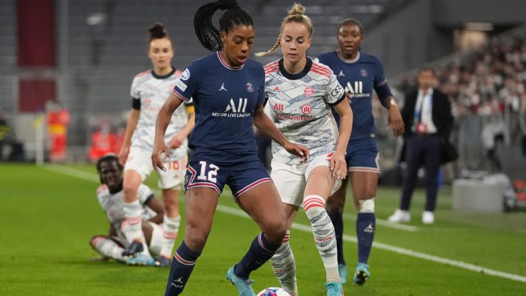 PSG's Ashley Lawrence, left, and Bayern's Giulia Gwinn fight for the ball during the women's quarterfinal Champions League first leg soccer match between Bayern Munich and Paris Saint-Germain in Munich, Germany, Tuesday, March 22, 2022. (Matthias Schrader/AP)