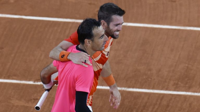 Croatia's Ivan Dodig, left, and Austin Krajicek of the U.S. celebrate winning the men's doubles final match of the French Open tennis tournament against Belgium's Joran Vliegen and Sander Gille in two sets, 6-3, 6-1, at the Roland Garros stadium in Paris, Saturday, June 10, 2023. (Jean-François Badias)