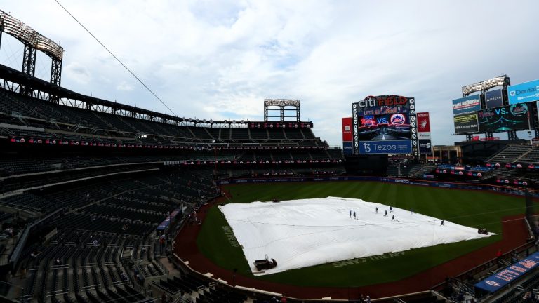 Citi Field is covered with a tarp before a baseball game between the New York Mets and the Philadelphia Phillies, Saturday, May 28, 2022, in New York. (Jessie Alcheh/AP Photo)
