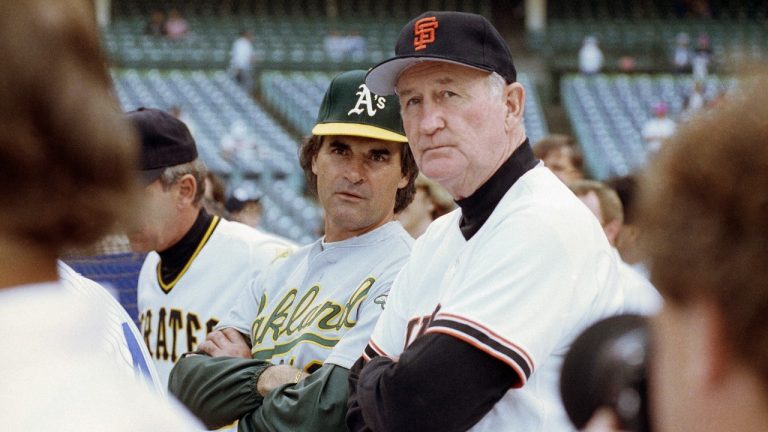 American League manager Tony La Russa, center left, from the Oakland A's, and National League manager Roger Craig, of the San Francisco Giants, watch batting practice at Wrigley Field in Chicago, July 10, 1990, before the start of the 61st All-Star Game. Craig, who pitched for three championship teams during his major league career and then managed the San Francisco Giants to the 1989 World Series that was interrupted by a massive earthquake, died Sunday, June 4, 2023. He was 93. (Rob Kozloff/AP File)