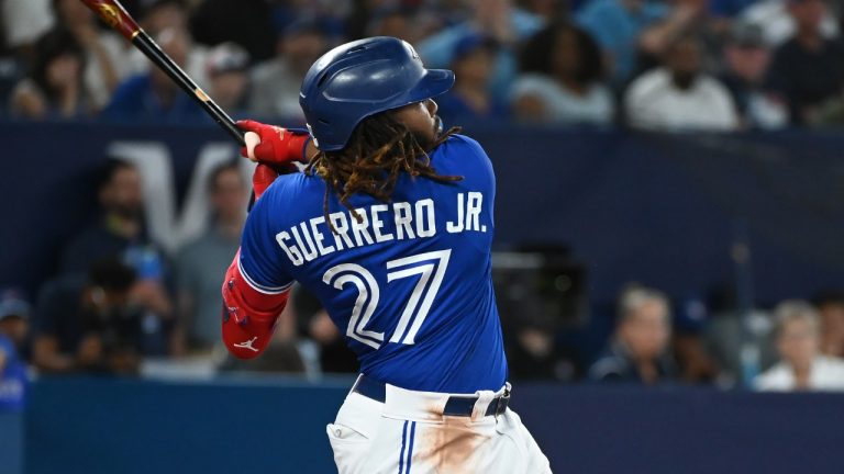 Toronto Blue Jays first baseman Vladimir Guerrero Jr. (27) hits a two-run home run, scoring teammate Brandon Belt, not shown, against the Oakland Athletics in sixth inning American League baseball action in Toronto, Saturday, June 24, 2023. (Jon Blacker/CP)