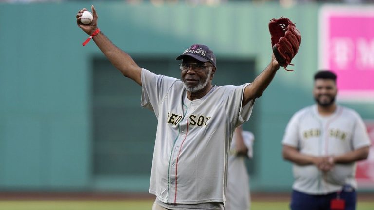 Juneteenth flag designer Ben Haith waves while standing on the mound at Fenway Park before throwing a ceremonial first pitch before a New York Yankees game against the Boston Red Sox, Sunday, June 18, 2023, in Boston. The Red Sox were among the teams marking the June 19 holiday this weekend. (Steven Senne/AP)