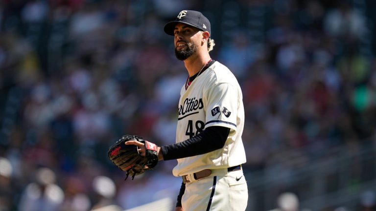 Minnesota Twins relief pitcher Jorge Lopez reacts after a two-run home run by Toronto Blue Jays' Daulton Varsho during the ninth inning of a baseball game Saturday, May 27, 2023, in Minneapolis. (AP)