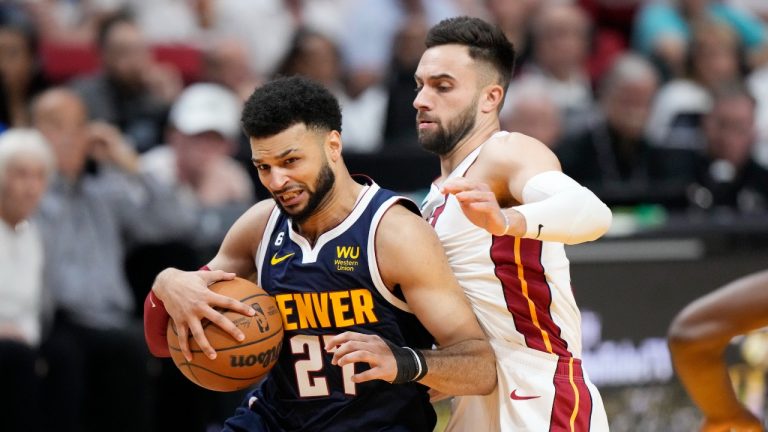 Miami Heat guard Max Strus (31) defends Denver Nuggets guard Jamal Murray (27) during the first half of Game 4 of the basketball NBA Finals, Friday, June 9, 2023, in Miami. (Wilfredo Lee/AP Photo)