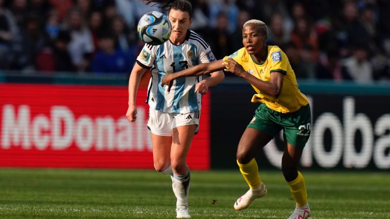 Argentina's Sophia Braun (13) and South Africa's Mapula Kgoale battle for the ball during the Women's World Cup Group G soccer match between Argentina and South Africa in Dunedin, New Zealand, Friday, July 28, 2023. (Alessandra Tarantino/AP)