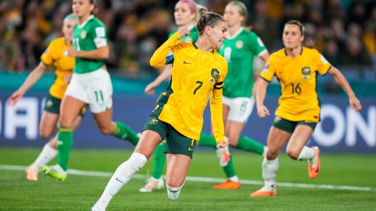 Australia's Steph Catley, center, celebrates after scoring the opening goal during the Women's World Cup soccer match between Australia and Ireland at Stadium Australia in Sydney, Australia, Thursday, July 20, 2023. (Rick Rycroft/AP)
