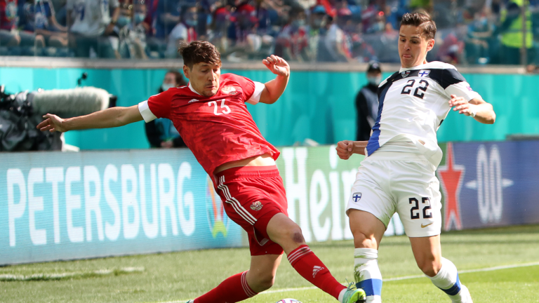 ST PETERSBURG, RUSSIA – JUNE 16, 2021: Russia's Daler Kuzyayev (L) and Finland's Jukka Raitala in a UEFA Euro 2020 Group B match between Finland and Russia at Saint Petersburg Stadium (also known as Krestovsky Stadium or Gazprom Arena). Alexander Demianchuk/TASS