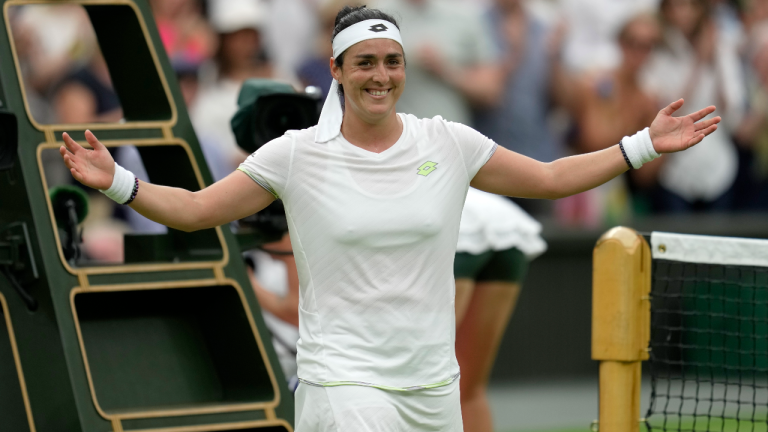 Tunisia's Ons Jabeur celebrates winning against Aryna Sabalenka of Belarus during their women's semifinal singles match on day eleven of the Wimbledon tennis championships in London, Thursday, July 13, 2023. (AP)