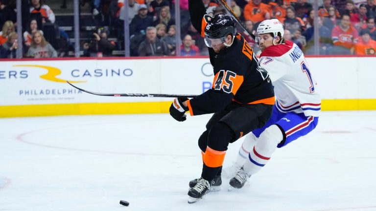 Philadelphia Flyers' Cam York, left, and Montreal Canadiens' Josh Anderson battle for the puck during the first period of an NHL hockey game, Friday, Feb. 24, 2023, in Philadelphia. (Matt Slocum/AP)
