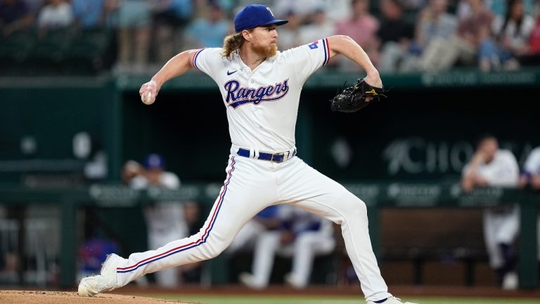 Texas Rangers starting pitcher Jon Gray throws to the Tampa Bay Rays in the first inning of a baseball game, Wednesday, July 19, 2023, in Arlington, Texas. (AP Photo/Tony Gutierrez)