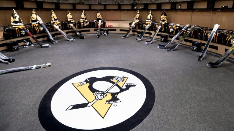 The team logo is in the centre of the Pittsburgh Penguins locker room before players come in to talk to the media before leaving for the off season two days after being swept by the New York Islanders in the first round of the NHL hockey playoffs, Thursday, April 18, 2019, at their practice facility in Cranberry Township, Pa. (Keith Srakocic/AP)