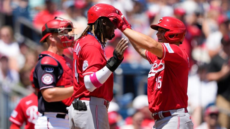 Cincinnati Reds' Nick Senzel, right, celebrates with teammate Elly De La Cruz after batting De La Cruz in on a three-run home run in the third inning of a baseball game against the Washington Nationals, Tuesday, July 4, 2023, in Washington. (Patrick Semansky/AP)