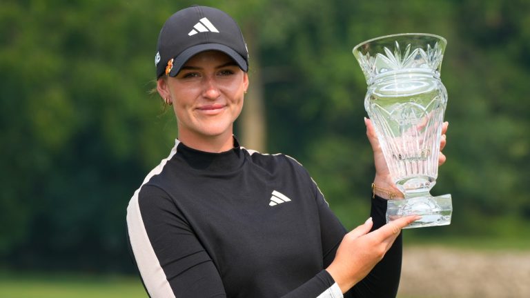 Linn Grant of Sweden poses with the winner's trophy after the final round of the Dana Open golf tournament at Highland Meadows Golf Club, Sunday, July 16, 2023, in Sylvania, Ohio. (Carlos Osorio/AP)