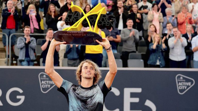 Germany's Alexander Zverev lifts the winner's trophy after beating Serbia's Laslo Djere during the men's singles final of the Hamburg European Open ATP tournament. (Frank Molter/AP)