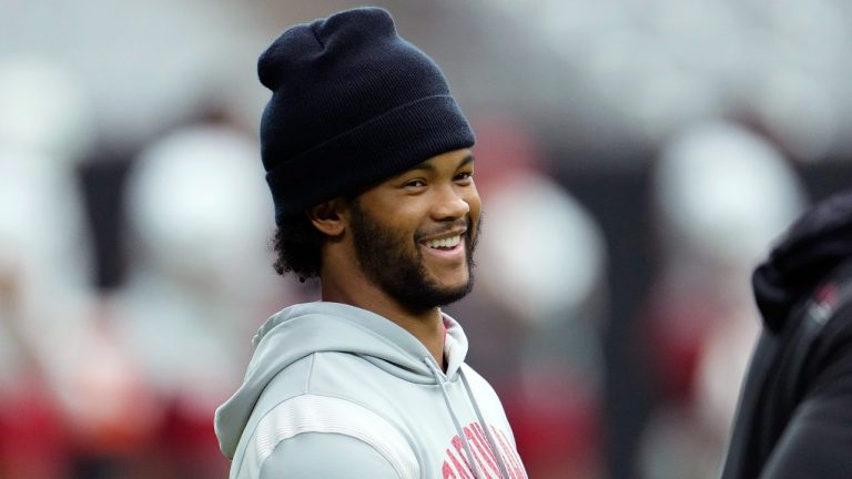Injured Arizona Cardinals quarterback Kyler Murray smiles as he talks with teammates during NFL football training camp practice at State Farm Stadium, Friday, July 28, 2023, in Glendale, Ariz. (Ross D. Franklin/AP)