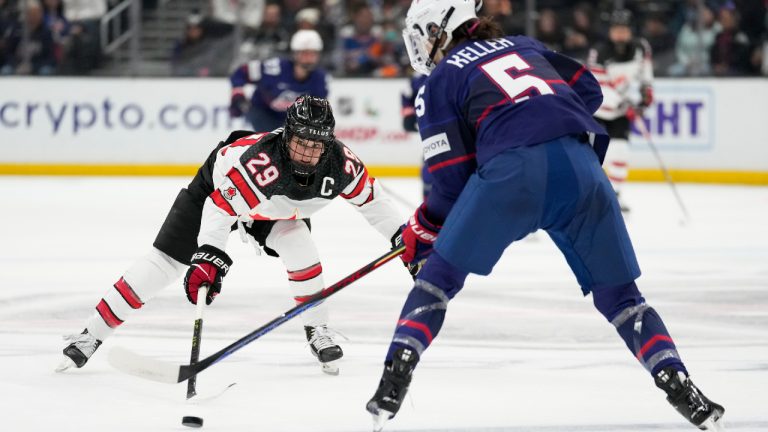 Canada forward Marie-Philip Poulin (29) defends against United States defender Megan Keller (5) during the first period of a Rivalry Series hockey game Monday, Dec. 19, 2022, in Los Angeles. (Ashley Landis/AP)