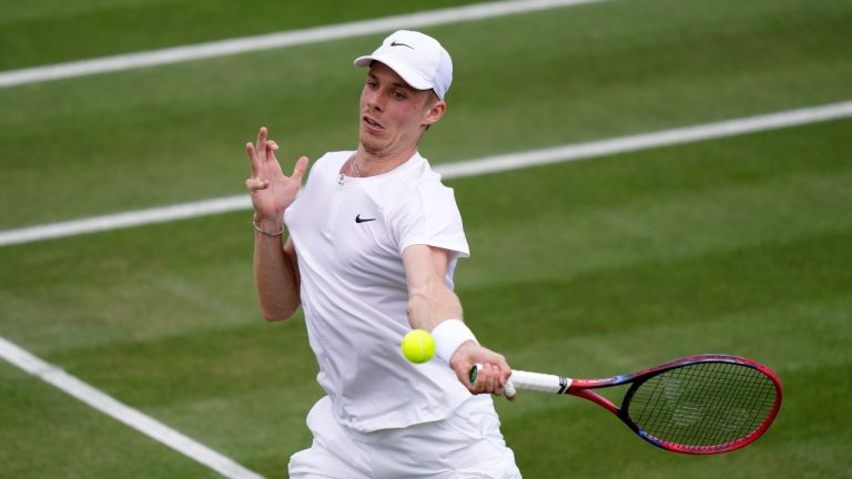 Canada's Denis Shapovalov returns to Gregoire Barrere of France in a men's singles match on day four of the Wimbledon tennis championships in London, Thursday, July 6, 2023. (Alberto Pezzali/AP Photo)