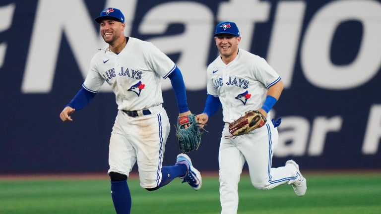Toronto Blue Jays right fielder George Springer (4) and centre fielder Daulton Varsho (25) celebrate after defeating the San Francisco Giants in MLB Interleague baseball action in Toronto, on Wednesday, June 28, 2023. (Frank Gunn/CP)
