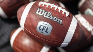 CFL logo seen on a football. (Nick Iwanyshyn/CP)