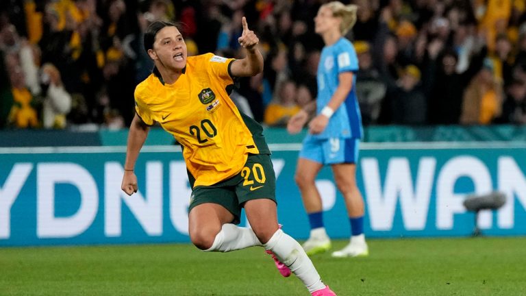 Australia's Sam Kerr celebrates after scoring her side's first goal during the Women's World Cup semifinal soccer match between Australia and England at Stadium Australia in Sydney, Australia, Wednesday, Aug. 16, 2023. (Rick Rycroft/AP)