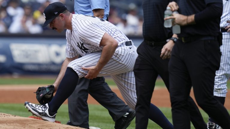 New York Yankees' Carlos Rodon, front left, stretches before being pulled during the third inning of a baseball game against the Houston Astros at Yankee Stadium, Sunday, Aug. 6, 2023, in New York. (Seth Wenig/AP)