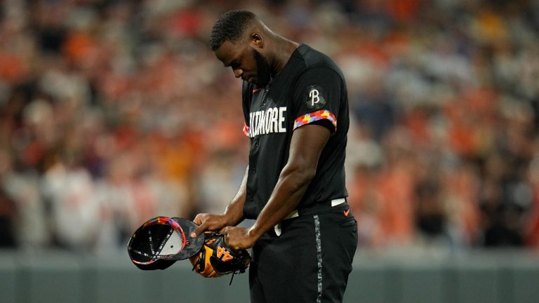 Baltimore Orioles relief pitcher Felix Bautista reacts after a pitch against the Colorado Rockies during the ninth inning of a baseball game, Friday, Aug. 25, 2023, in Baltimore. The Orioles won 5-4. Bautista left the game after the pitch. (Julio Cortez/AP)