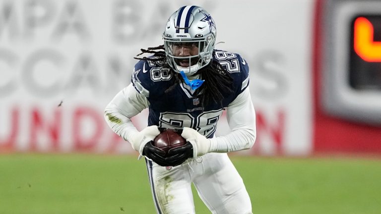 Dallas Cowboys safety Malik Hooker (28) runs after picking up a fumble against the Tampa Bay Buccaneers during the second half of an NFL wild-card football game. (AP Photo/Chris Carlson)