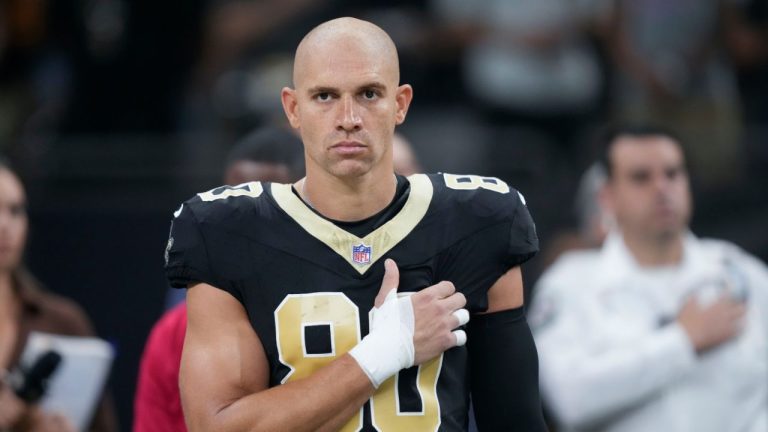 New Orleans Saints tight end Jimmy Graham holds his hand to his heart during the singing of the national anthem in the first half of an NFL football game against the Kansas City Chiefs in New Orleans, Sunday, Aug. 13, 2023. (Gerald Herbert/AP Photo)