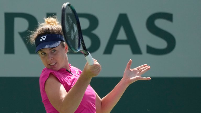 Linda Noskova from Czech Republic returns a shot to Poland's Iga Swiatek during their third round match at the Poland Open tennis tournament in Warsaw, Poland, Saturday, July 29, 2023. (Czarek Sokolowski/AP)