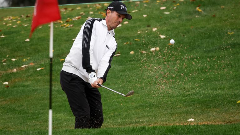 Canada's Mike Weir hits from a sand trap onto the 18th green during the first round at the PGA Tour Champions Shaw Charity Classic golf event in Calgary, Alta., Friday, Aug. 18, 2023. (Jeff McIntosh/CP)